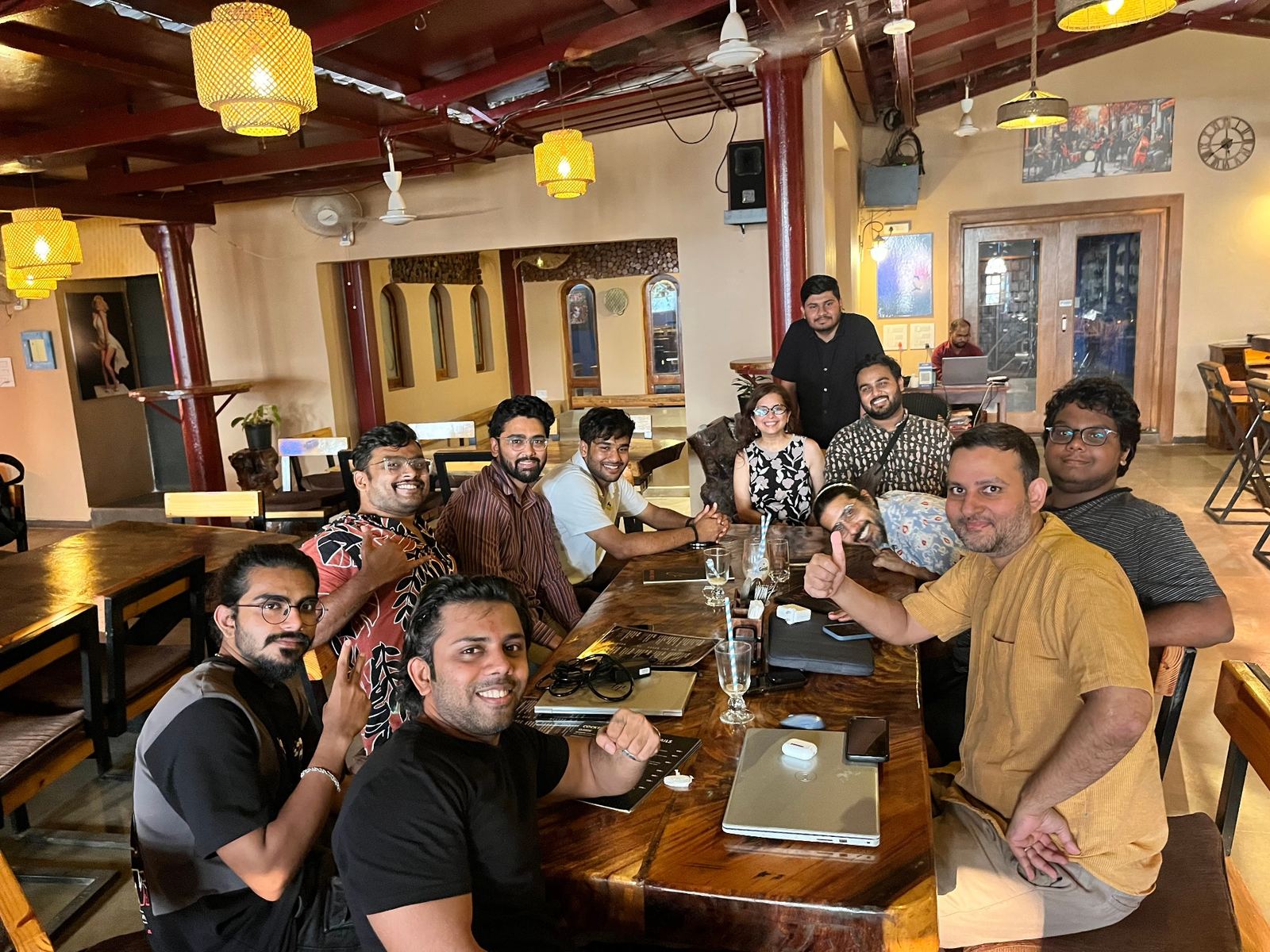 cohort gathered around the long table in the evening
